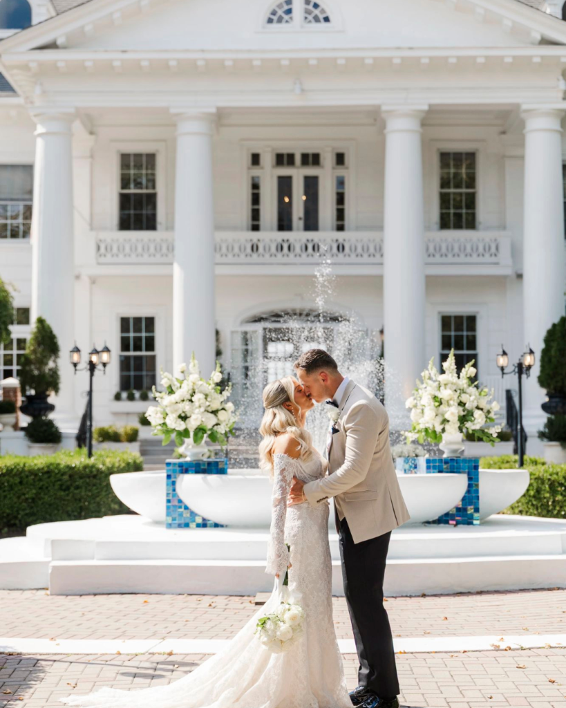 Wedding couple in front of the fountain at The Briarcliff Manor