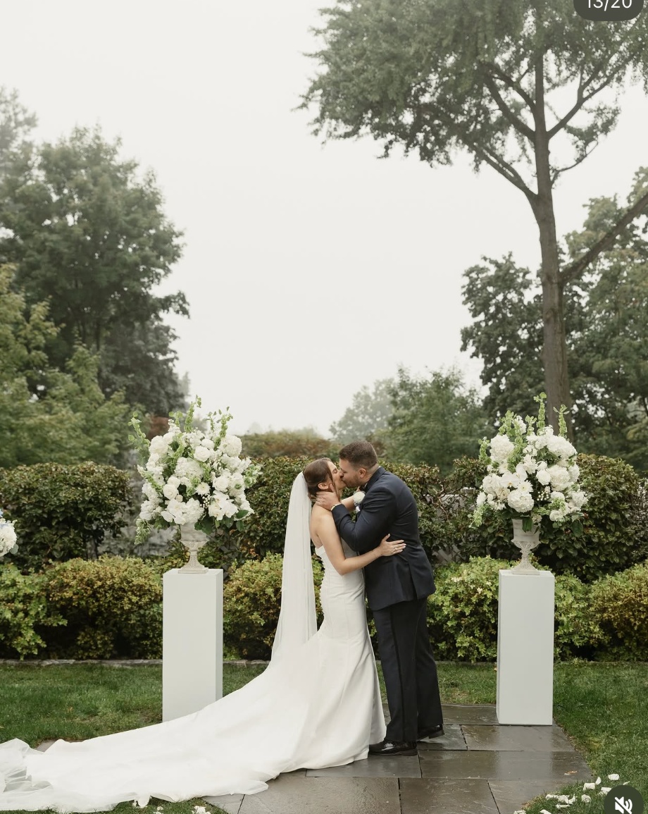 Alyssa and her partner during their outdoor ceremony at The Briarcliff Manor